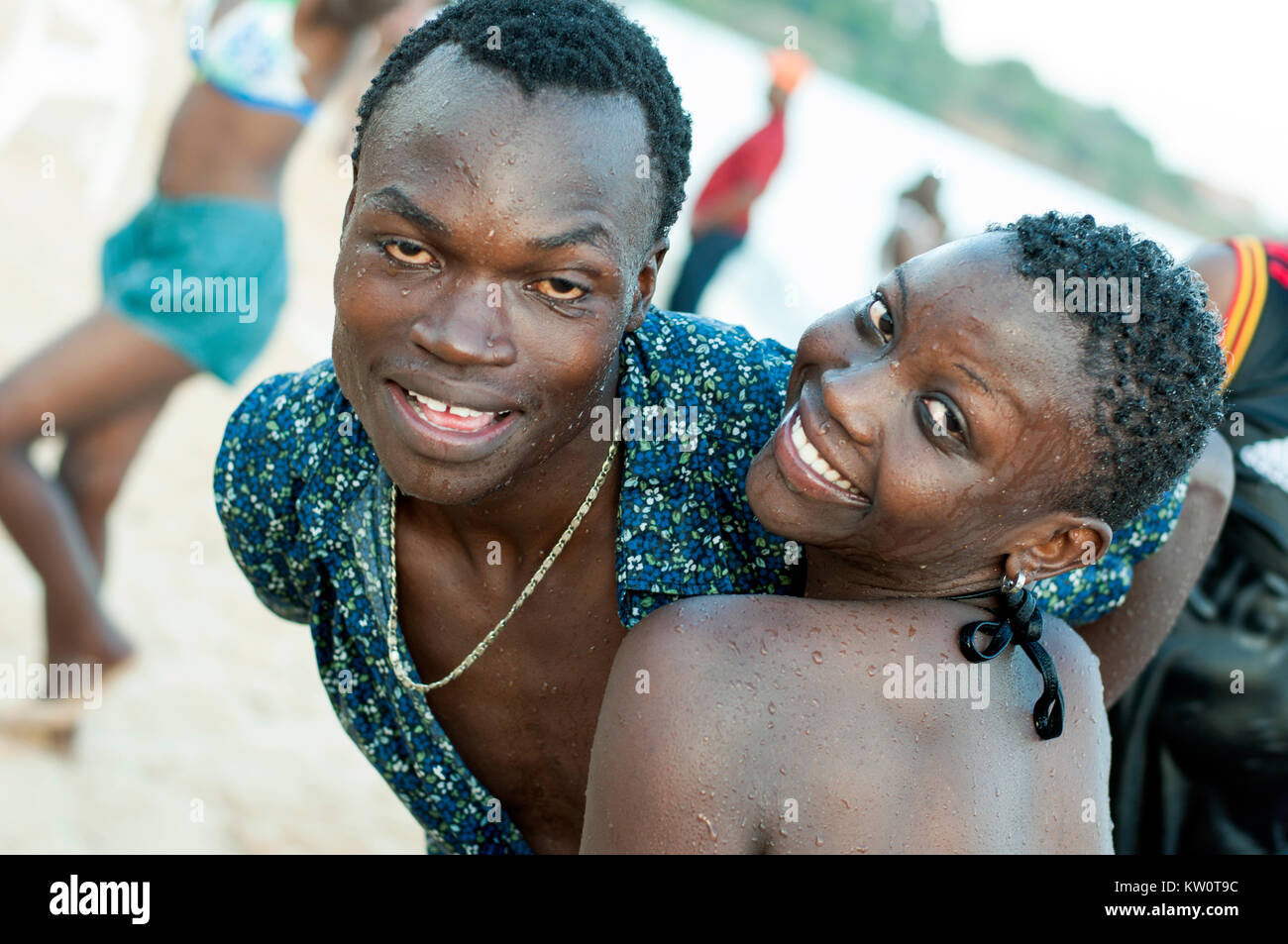 Young people posing for photo on Lido Beach on Lake Victoria, Entebbe, Wakiso, Uganda Stock Photo