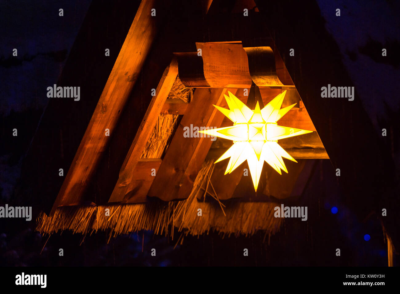 Golden star christmas decoration on christmas tree Stock Photo - Alamy