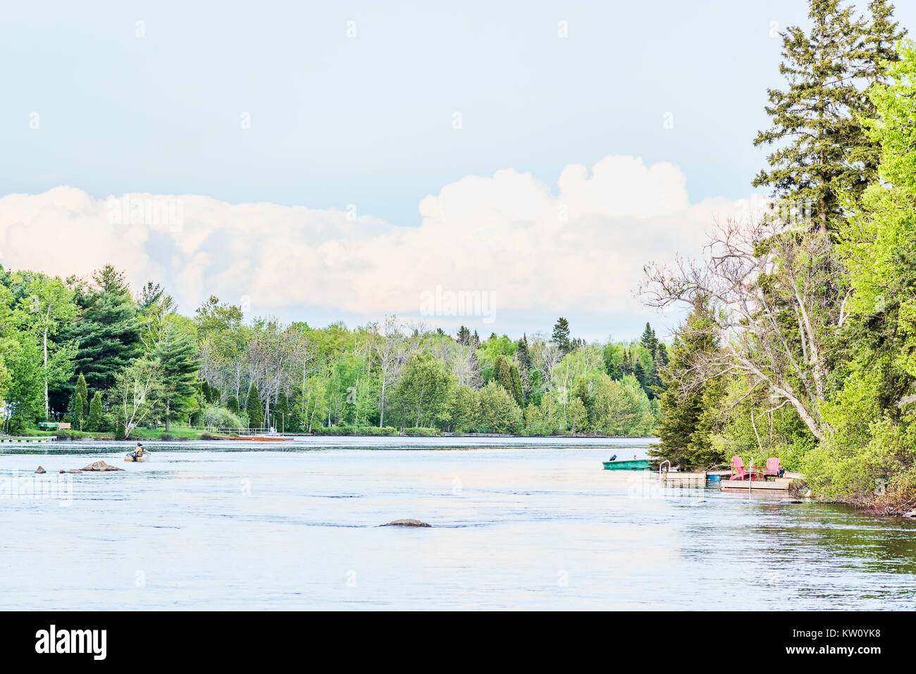 Chicoutimi river in Saguenay, Quebec, Canada with riverfront houses