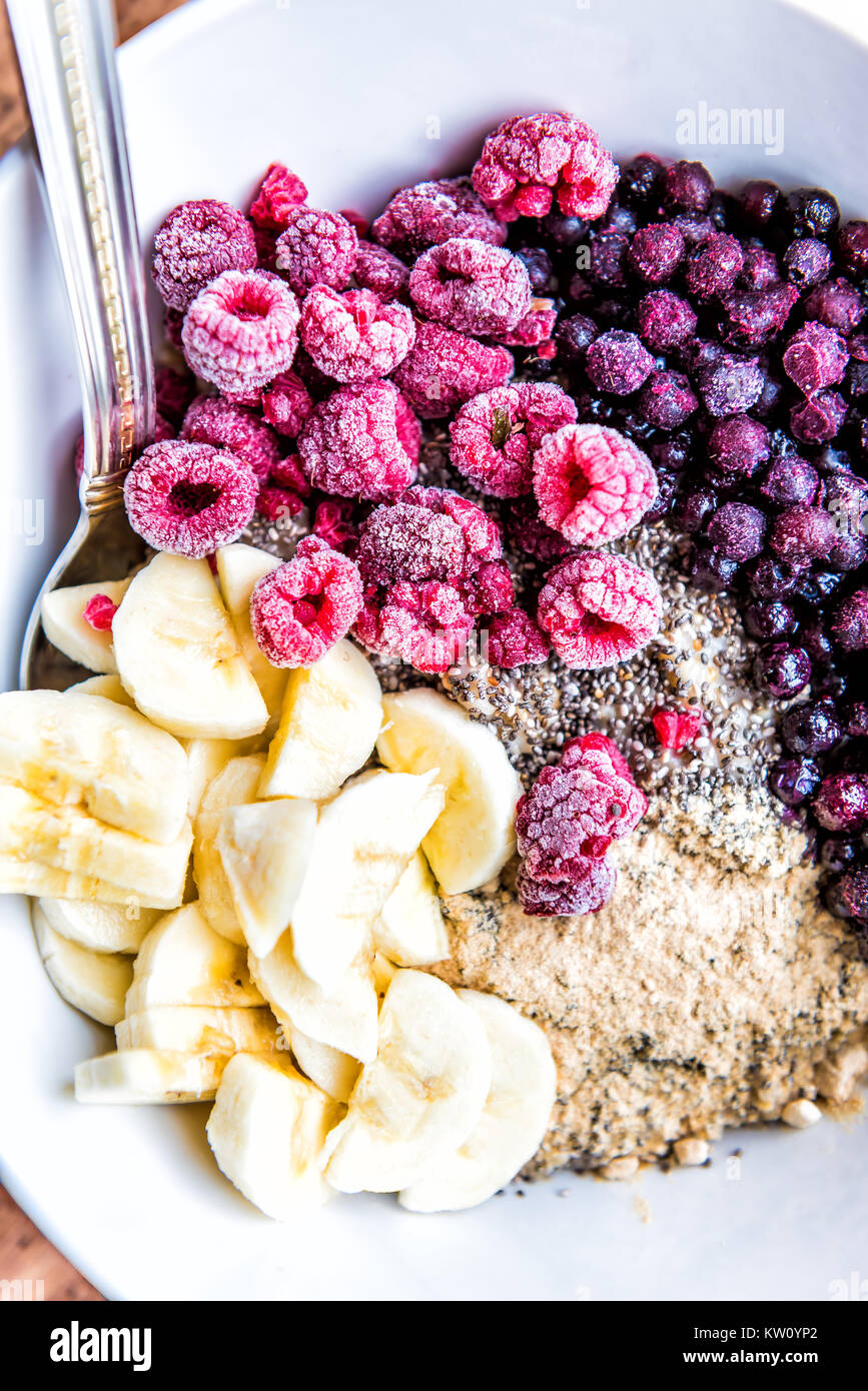 Frozen Blueberries Raspberries Banana Maca And Chia Seeds Toppings On Oat Porridge Stock 7203