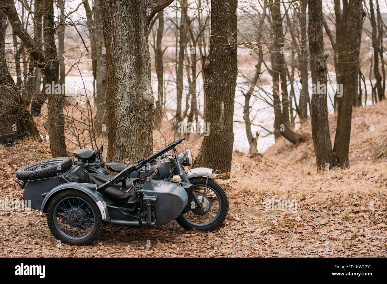 Old Tricar, Three-Wheeled Motorbike With Machine Gun On Sidecar Of Wehrmacht, Armed Forces Of Germany Of World War II Time In Autumn Forest. Stock Photo