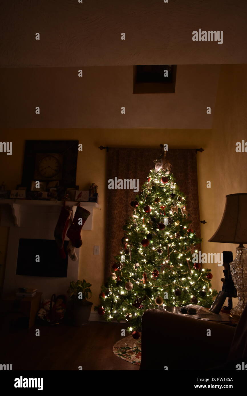 Christmas Tree scene with hanging stockings on the mantle Stock Photo