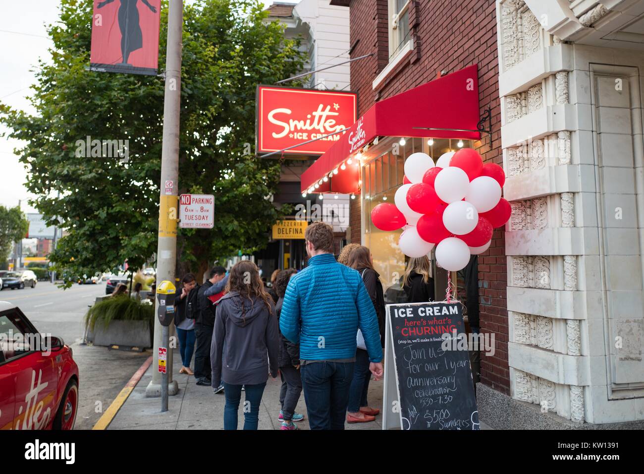 Customers line up outside Smitten Ice Cream, a California-based ice cream store which flash freezes its product using liquid nitrogen, in the Pacific Heights neighborhood of San Francisco, California, 2016. Stock Photo