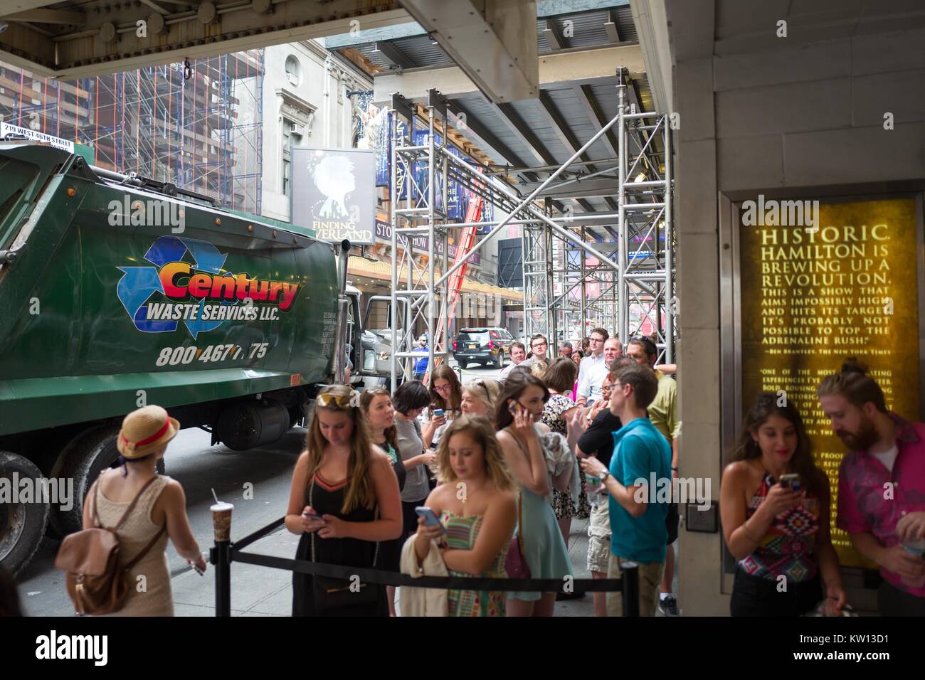 Before a performance of the Broadway musical Hamilton two days prior to creator Lin Manuel Miranda's departure from the show, fans wait in line and prepare to enter the Richard Rodgers theatre, New York City, New York, July 7, 2016. Stock Photo