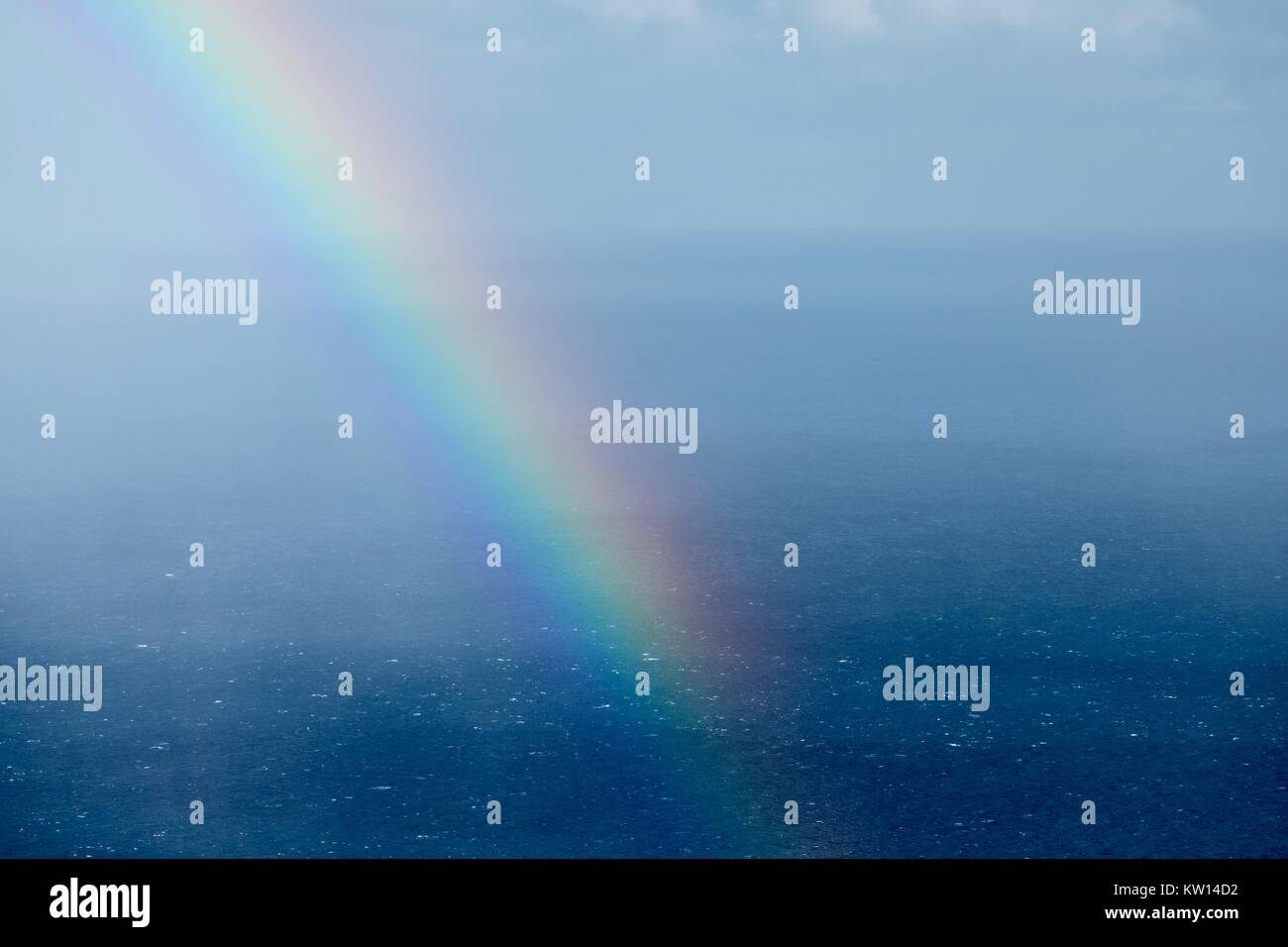 Rainbow over the ocean Stock Photo - Alamy