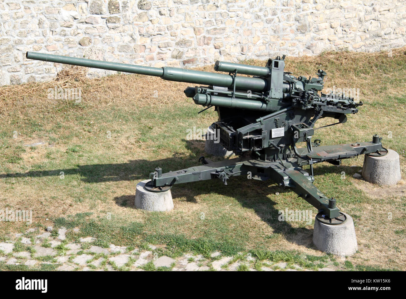 Old big green anti-aircraft gun near the wall of Belgrade fortress, Serbia Stock Photo