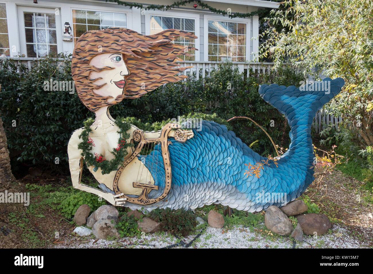 A mermaid sculpture by artist Patrick Amiot, on display in front of a home on Florence Avenue in Sebastopol, Ca, USA. Stock Photo