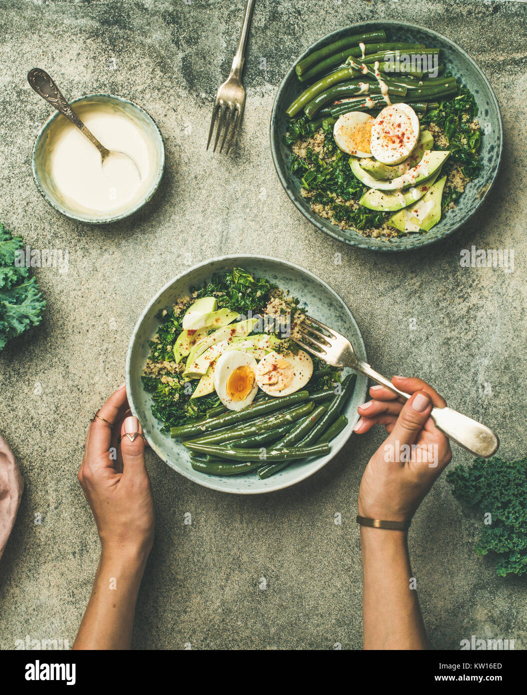 Healthy vegetarian breakfast bowls flatlay. Quinoa, kale, green beans