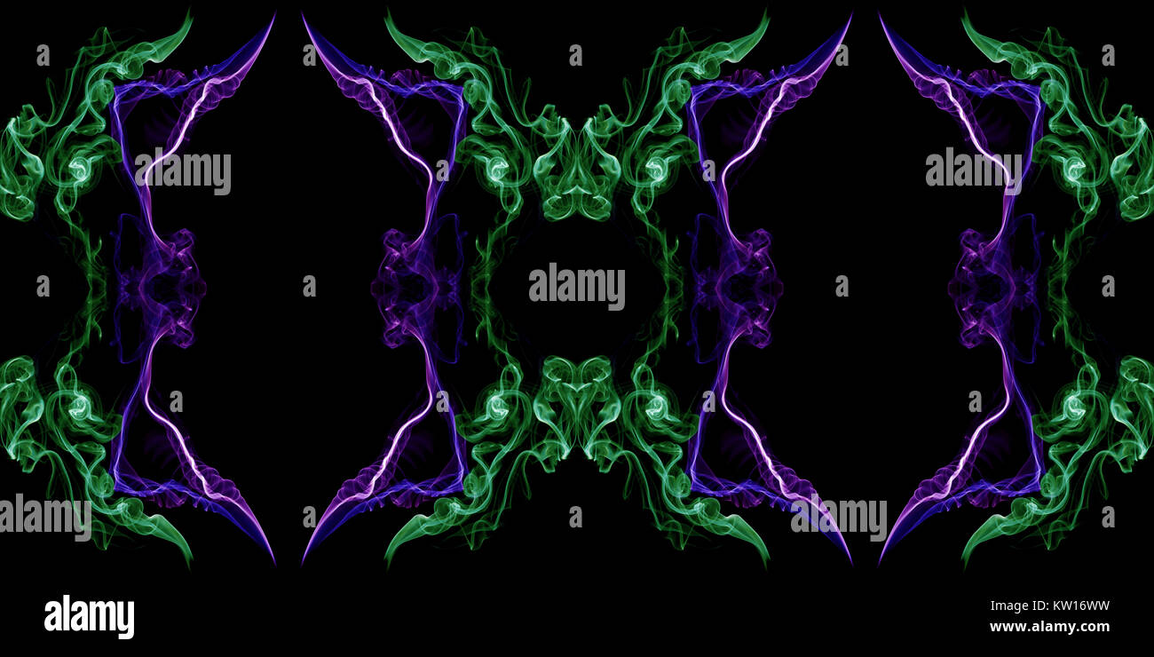 Green and violet abstract twisted smoke isolated on black background, formed in circles, projected as an infinity loop Stock Photo