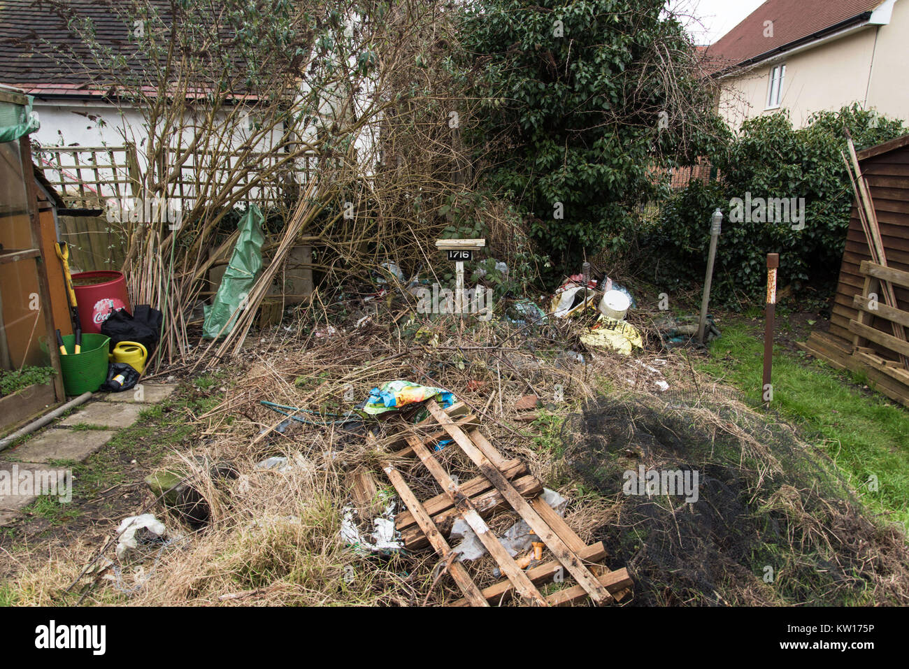 Landscape image of really messy garden allotment big rubbish pile ... - LanDscape Image Of Really Messy GarDen Allotment Big Rubbish Pile KW175P