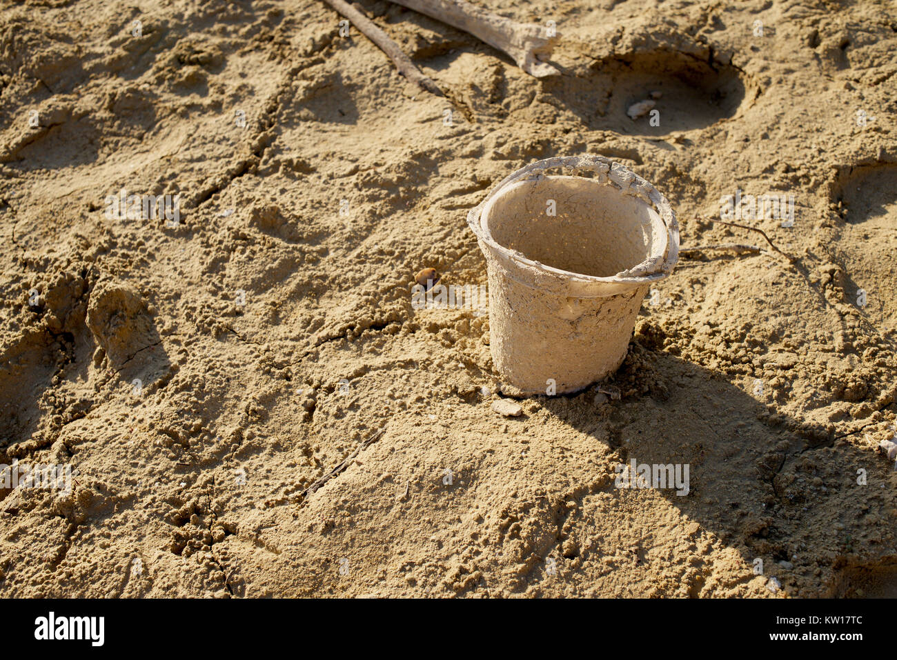 Bucket in the mud of a low level reservoir Stock Photo Alamy
