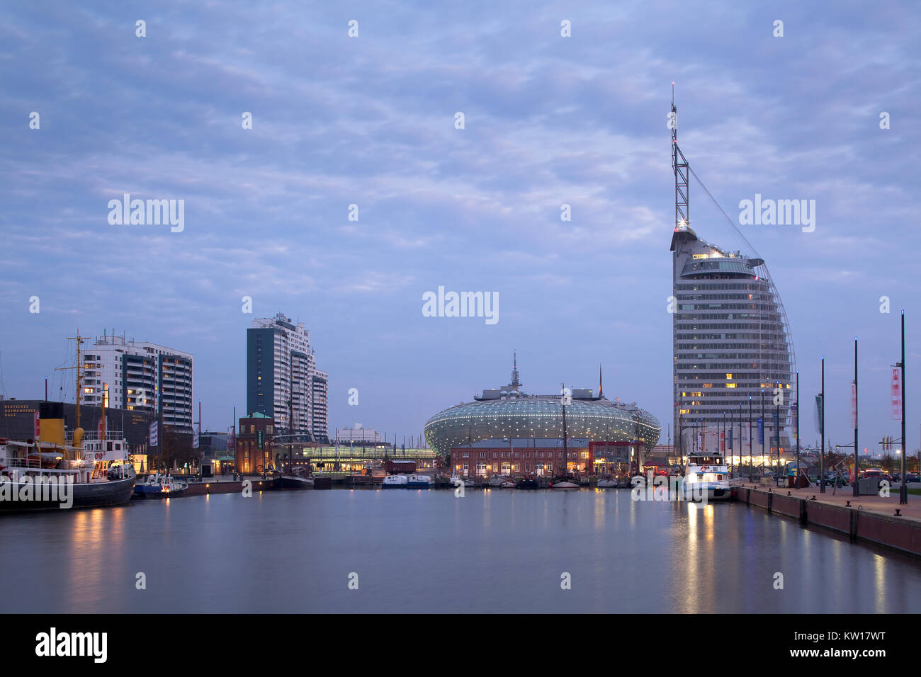 'Neuer Hafen' in Bremerhaven at the estuary of the River Weser in Northern Germany, with 'Klimahaus', Atlantic Hotel Sail City and Columbus Center Stock Photo