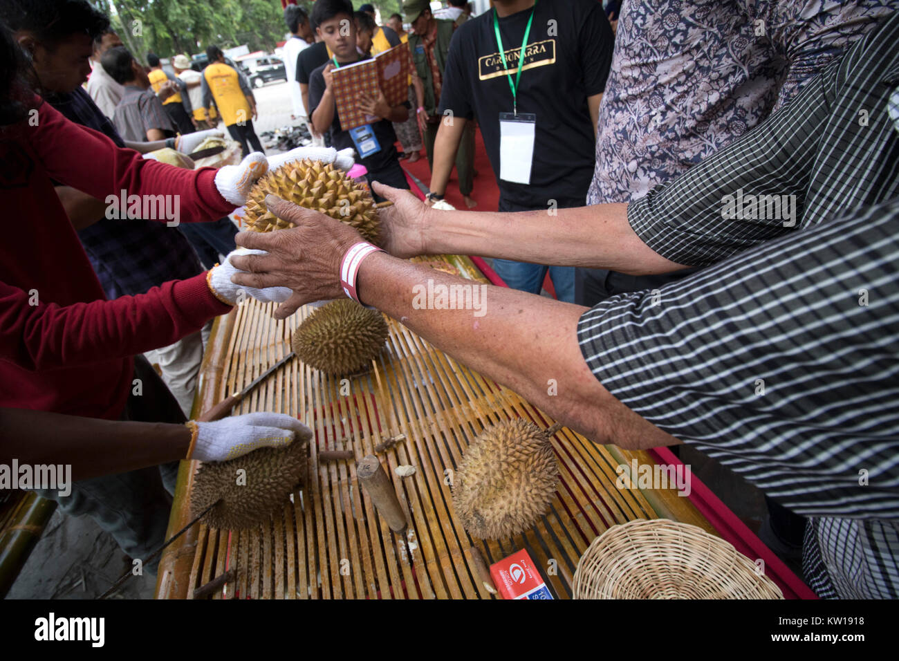 Banda Aceh, Indonesia. 29th Dec, 2017. A consumer takes a durian during durian party in Banda