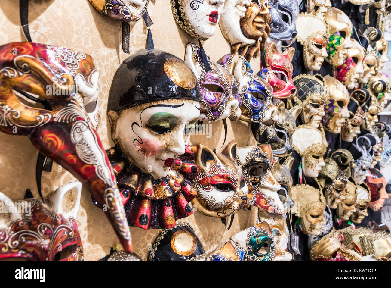 Venetian carnival masks in the wall of a shop in Venice, Veneto, Italy Stock Photo