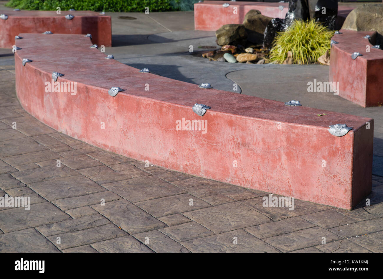 Concrete wall or bench with anti-skate deterrent devices installed Stock Photo