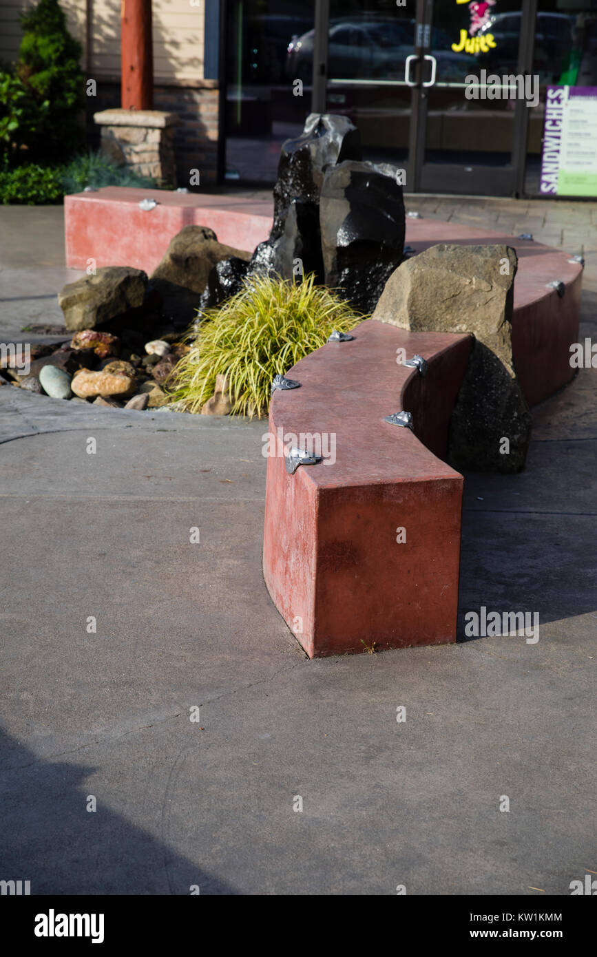 Concrete wall or bench with anti-skate deterrent devices installed Stock Photo