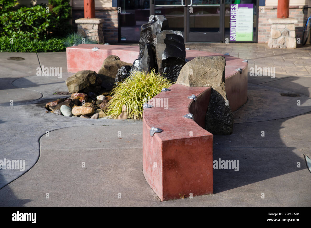 Concrete wall or bench with anti-skate deterrent devices installed Stock Photo