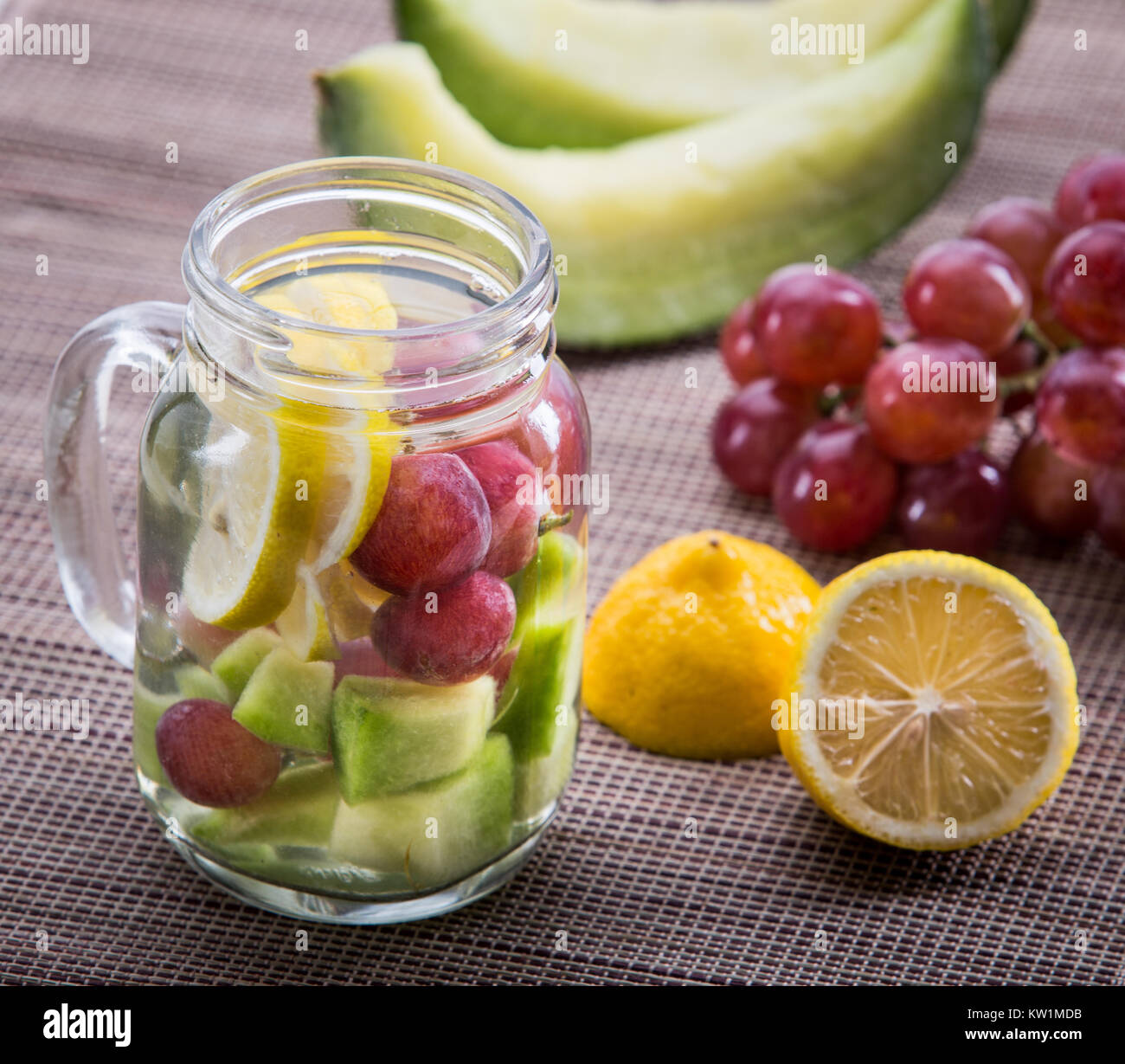 infused water mix of grape, lemon and melon Stock Photo Alamy