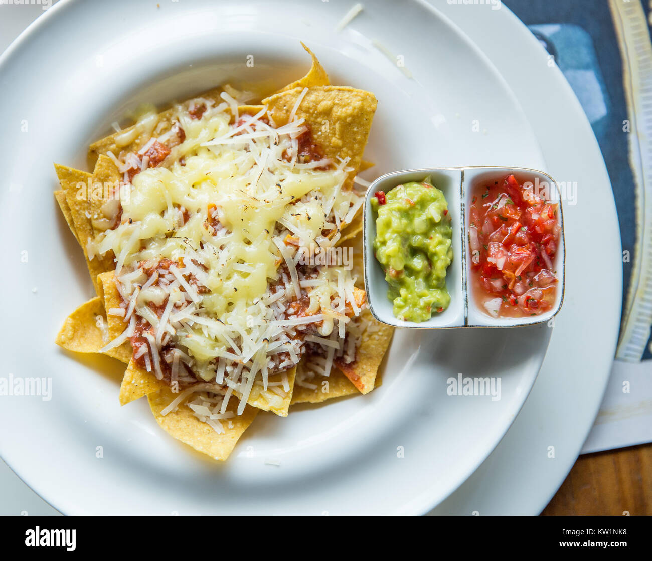 mexican food nachos with sauce and cheese Stock Photo - Alamy