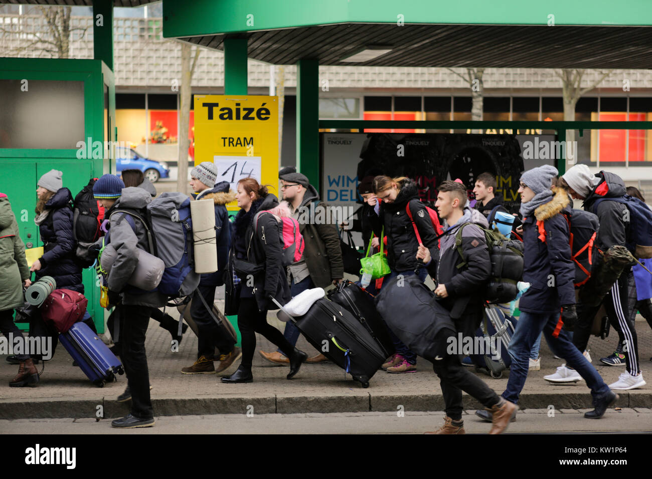 Basel, Switzerland. 28th Dec, 2017. Young pilgrims rush to the tram, to go to their host parishes. Several thousand young pilgrims from all over Europe and beyond arrived in Basel in Switzerland for the annual European Youth Meeting of the ecumenical Taize community. The meeting of prayers and meditation is held under the motto 'Pilgrimage of Trust on Earth' and is the 40th anniversary meeting. Credit: Michael Debets/Alamy Live News Stock Photo