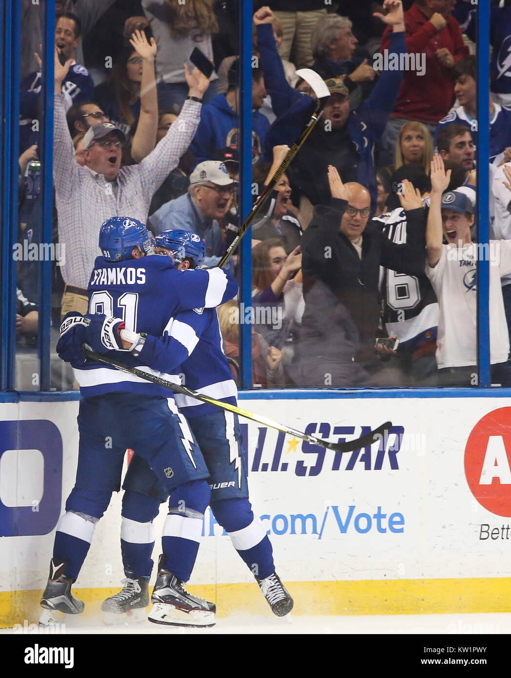 Tampa Bay Lightning center Brayden Point (21) celebrates with center Steven  Stamkos (91) and ri …