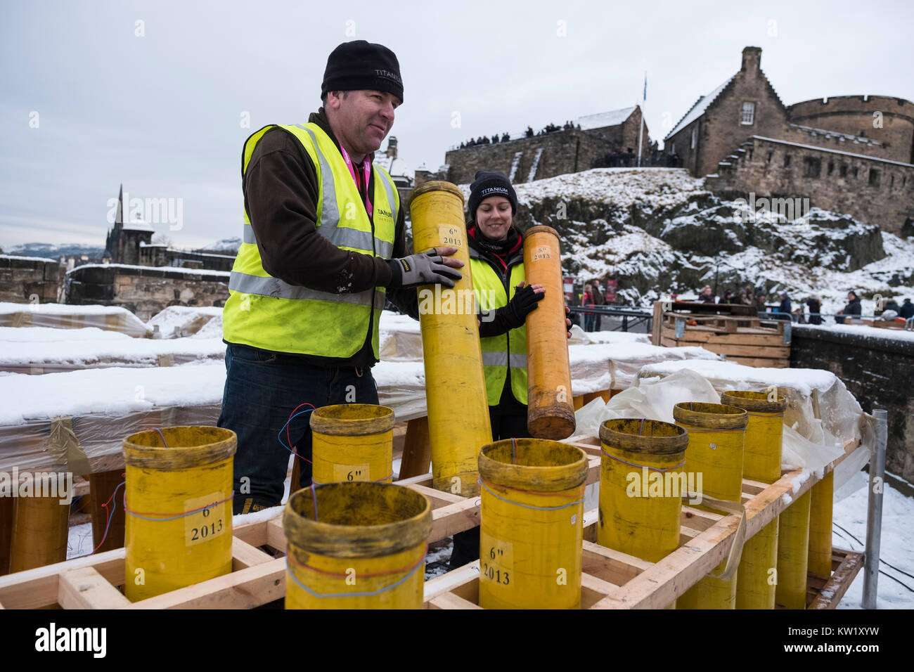 Edinburgh, Scotland, United Kingdom. 29th Dec, 2017. Pyrotechnicians from Titanium Fireworks demonstrate large fireworks and launching tubes at Edinburgh Castle ahead of the annual Hogmanay fireworks display on New Years Eve. Here 150mm launching tubes are handled by Lynn Wiseman and Shaun Gibson. These are the largest shells used in the display. Credit: Iain Masterton/Alamy Live News Stock Photo