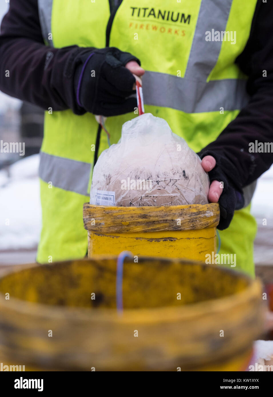 Edinburgh, Scotland, United Kingdom. 29th Dec, 2017. Pyrotechnicians from Titanium Fireworks demonstrate large fireworks and launching tubes at Edinburgh Castle ahead of the annual Hogmanay fireworks display on New Years Eve. Here a 150mm shell is shown being installed This is the largest shell used in the display. Credit: Iain Masterton/Alamy Live News Stock Photo