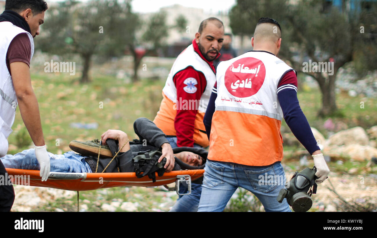 Palestinian Medics Carry A Wounded Palestinian Man On A Stretcher ...