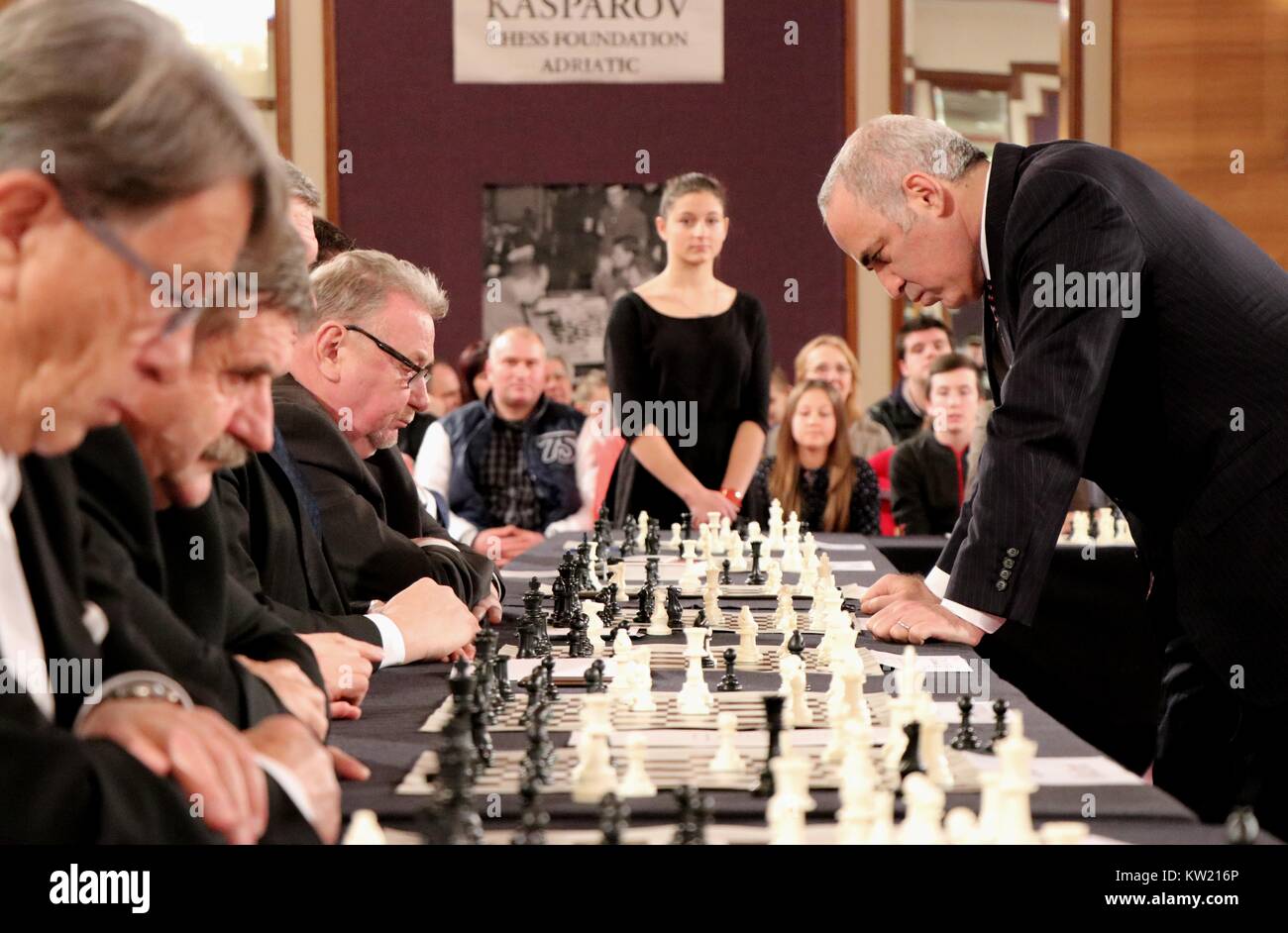 (171230) -- ZAGREB, Dec. 30, 2017(Xinhua) -- Russian chess grandmaster and former world champion Garry Kasparov plays against former Speaker of Croatian Parliament Vladimir Seks(4th L) during a simultaneous chess exhibition match in Zagreb, Croatia, on Dec. 29, 2017. (Xinhua/Relja Dusek) Stock Photo