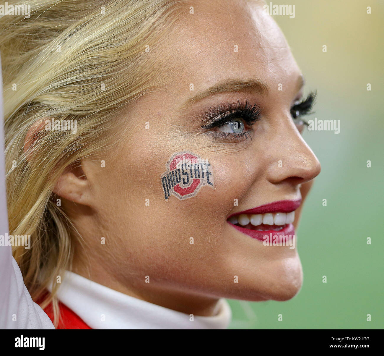 Arlington, TX, USA. 29th Dec, 2017. An Ohio State Buckeyes cheerleader cheers on her team in the second quarter during the Goodyear Cotton Bowl Classic between the USC Trojans and the Ohio State Buckeyes at AT&T Stadium in Arlington, TX. John Glaser/CSM/Alamy Live News Stock Photo