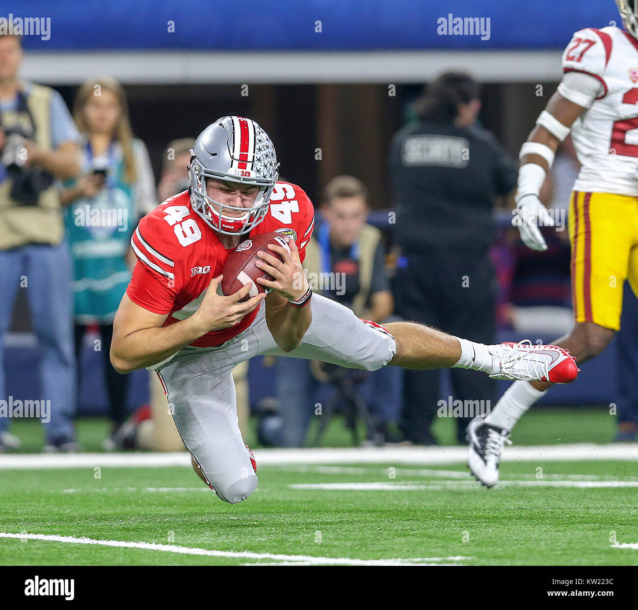 Arlington, TX, USA. 29th Dec, 2017. Ohio State Buckeyes long snapper Liam McCullough (49) saves a punt from going into the end zone in the second quarter during the Goodyear Cotton Bowl Classic between the USC Trojans and the Ohio State Buckeyes at AT&T Stadium in Arlington, TX. John Glaser/CSM/Alamy Live News Stock Photo