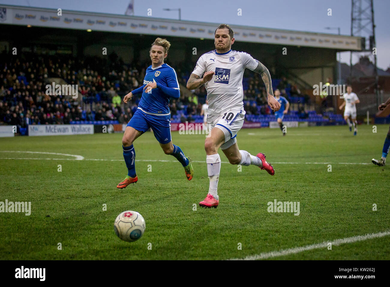 Wirral, Merseyside, UK. 30th December, 2017. James Norwood (Tranmere Rovers) runs to stop the ball going out and keep the Tranmere Rovers attack alive during Tranmere Rovers v Guiseley AFC in the Vanarama National League game on Saturday 30 December 2017 at Prenton Park, Tranmere, The Wirral, Merseyside. Photo by Mark P Doherty. Credit: Caught Light Photography Limited/Alamy Live News Stock Photo