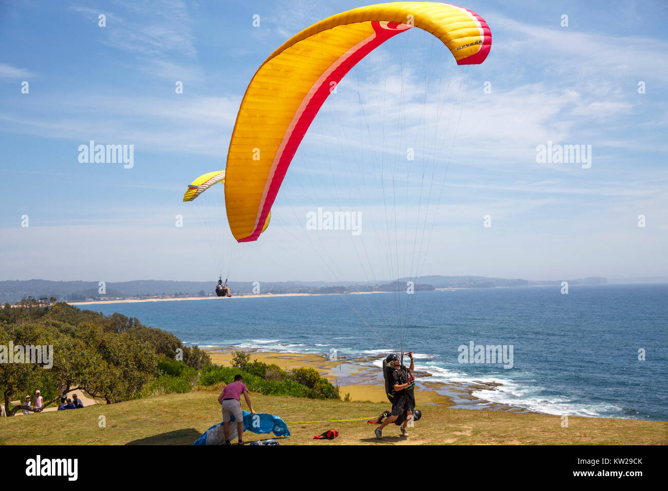 Paragliders enjoying the thermal currents at Long Reef Point on Sydney northern beaches,New South Wales,Australia Stock Photo