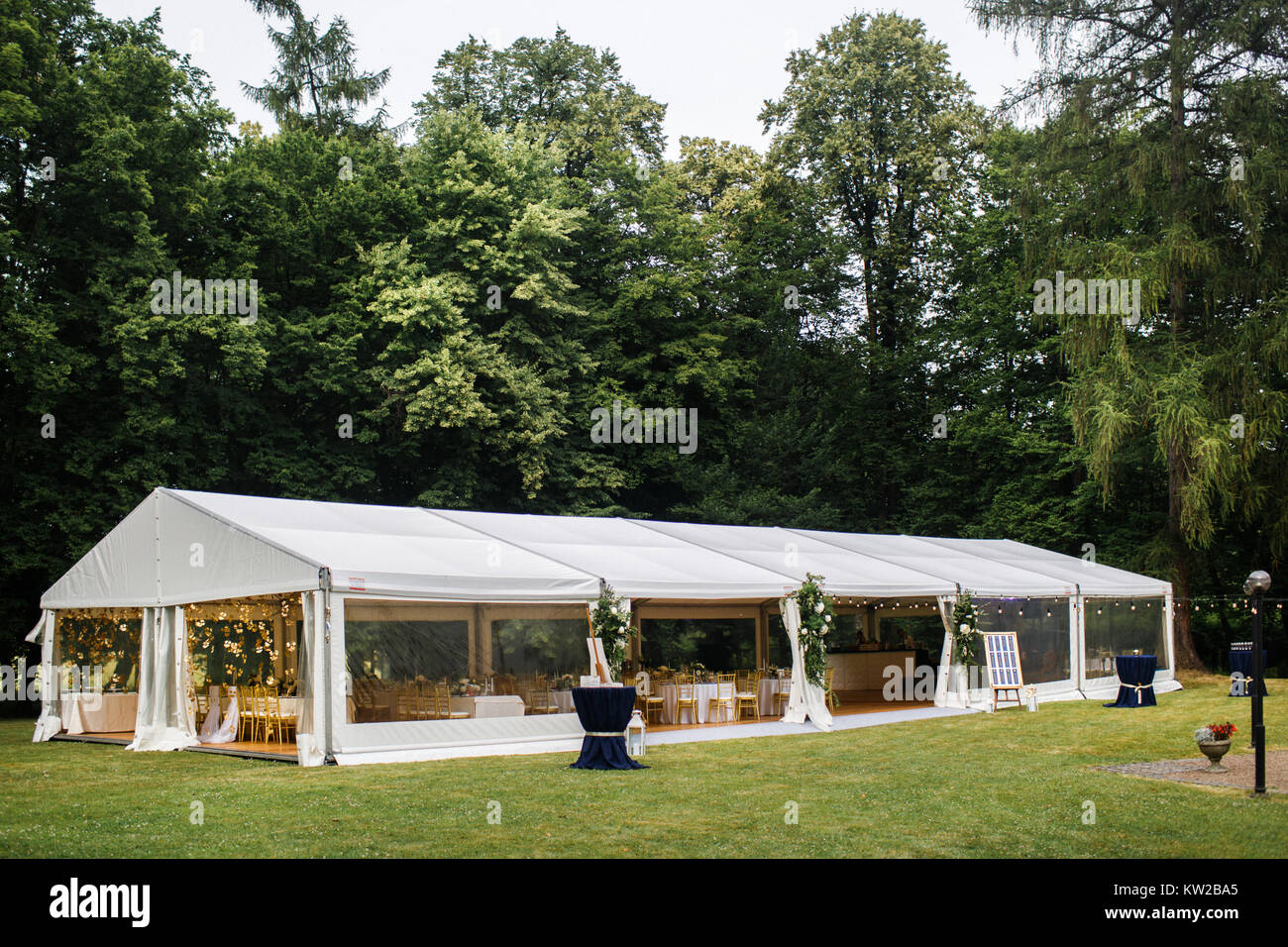 Long White Tent For Wedding Party In The Woods Stock Photo