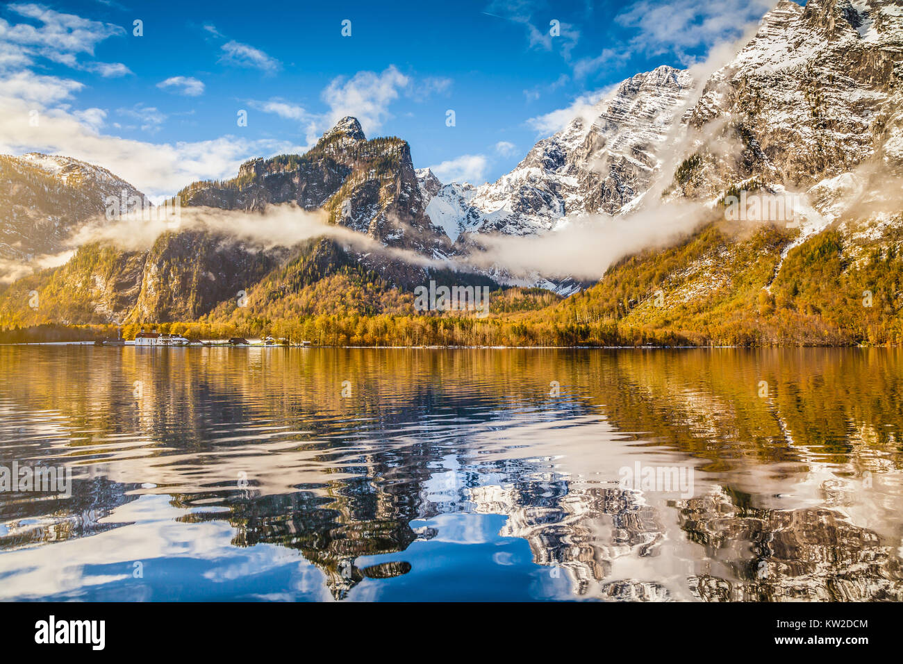 Idyllic autumn scene in the Alps with mountain lake reflection in beautiful morning light Stock Photo