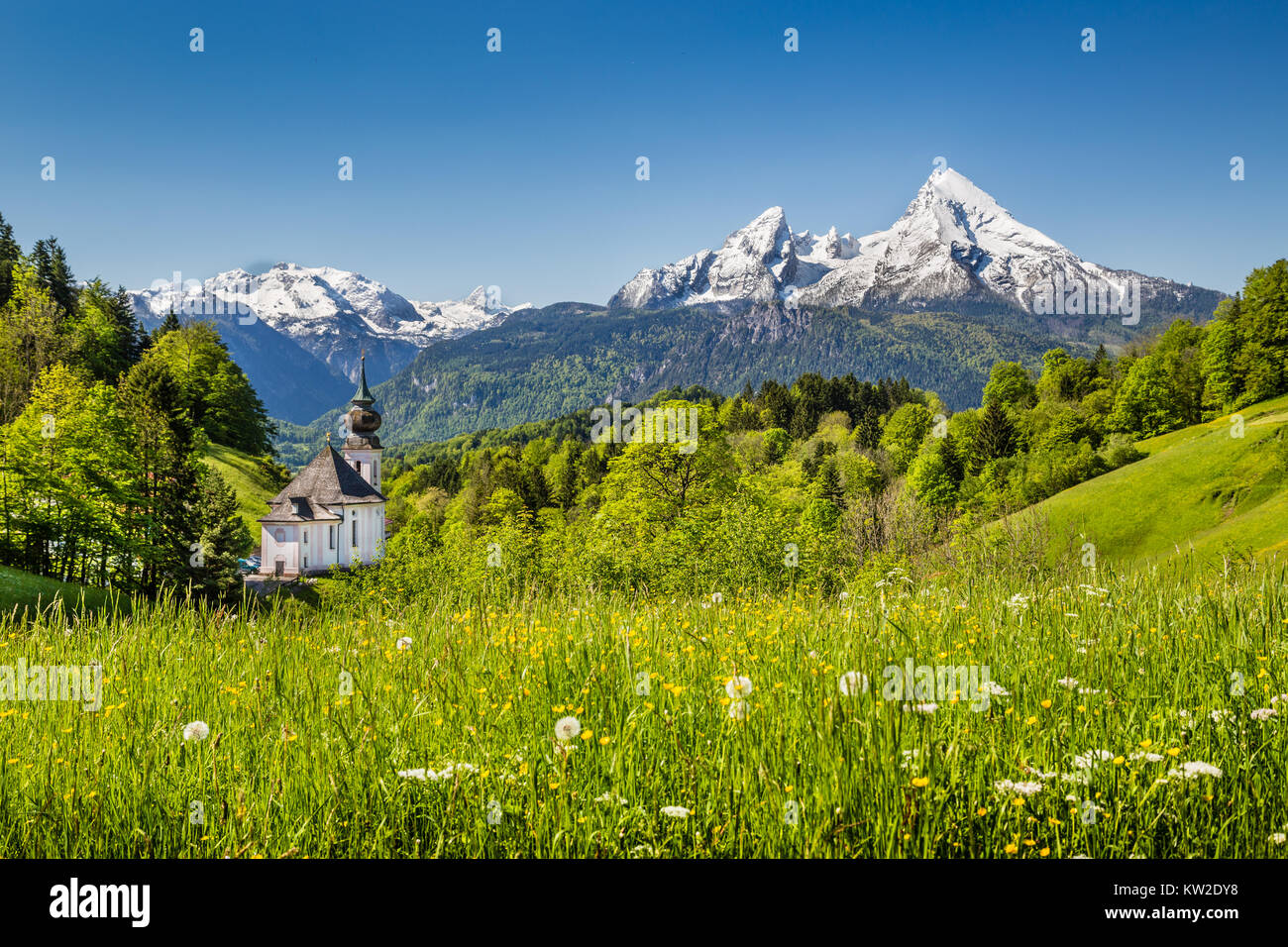 Beautiful mountain landscape in the Bavarian Alps with pilgrimage church of Maria Gern and Watzmann massif in the background, Nationalpark Berchtesgad Stock Photo