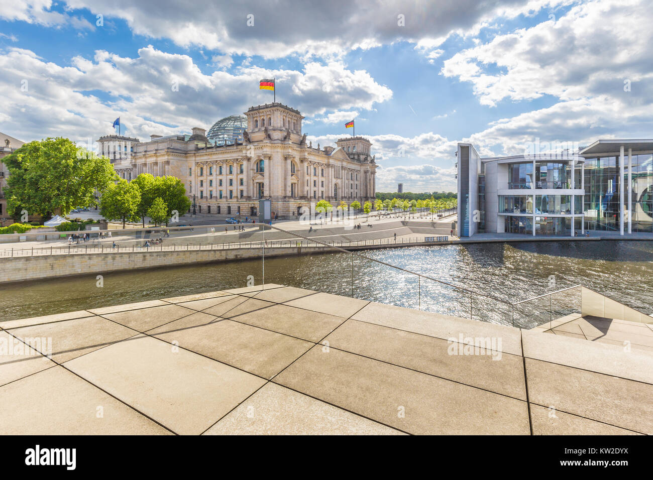 Panoramic view of Berlin government district with Spree river passing famous Reichstag building and Paul Lobe Haus on a beautiful sunny day with blue  Stock Photo