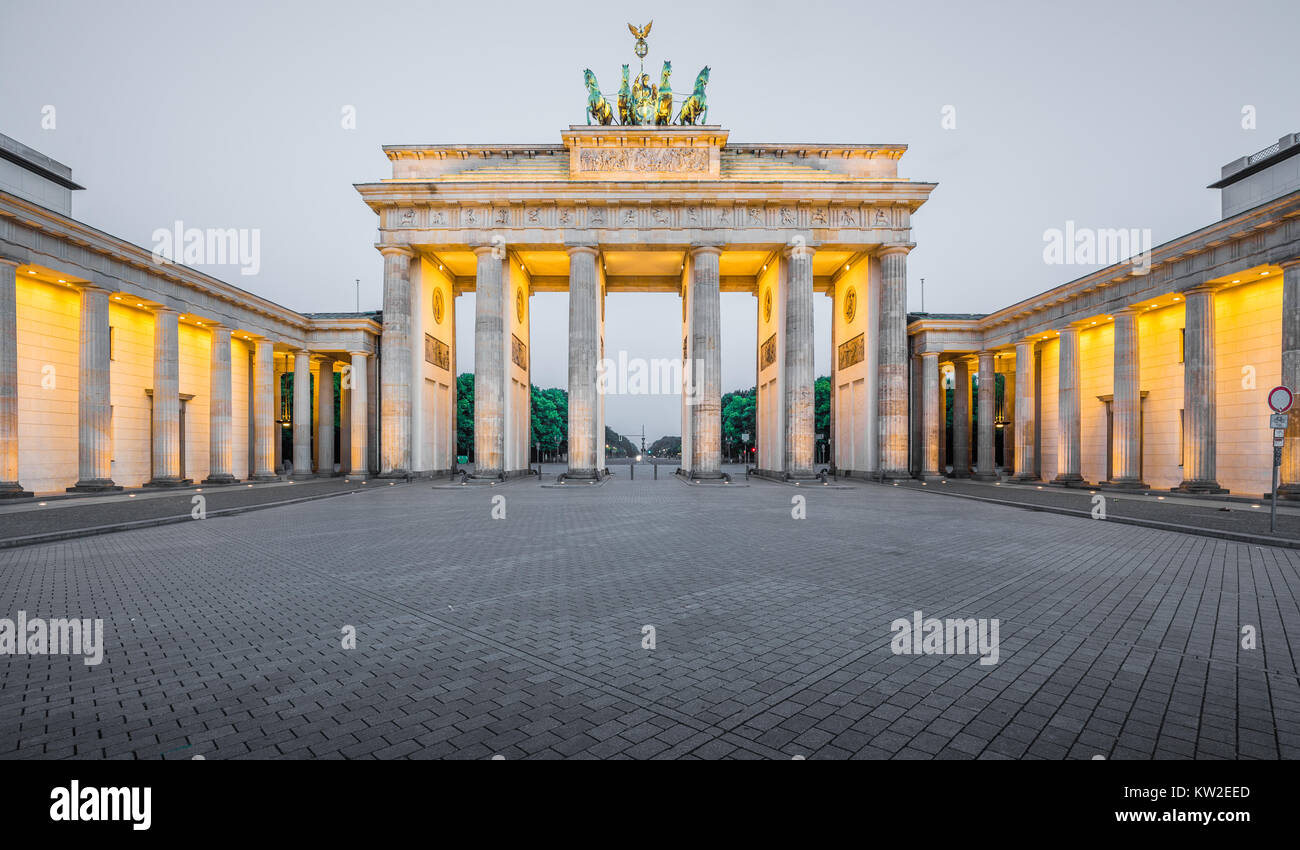 Classic panoramic view of historic Brandenburg Gate, Germany's most famous landmark and a national symbol, in post sunset twilight at dusk, Berlin Stock Photo