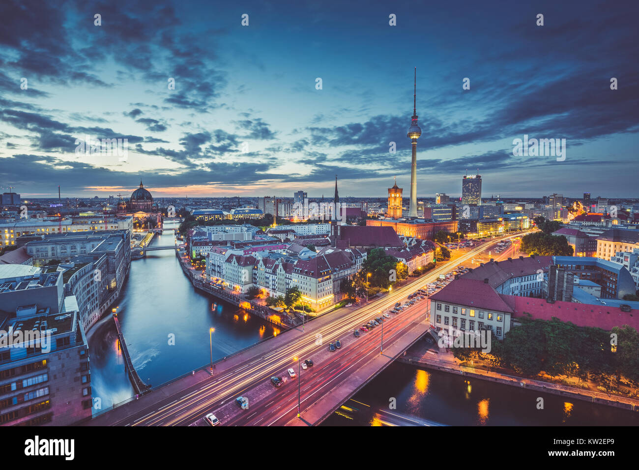 Aerial view of Berlin skyline with dramatic clouds in twilight during