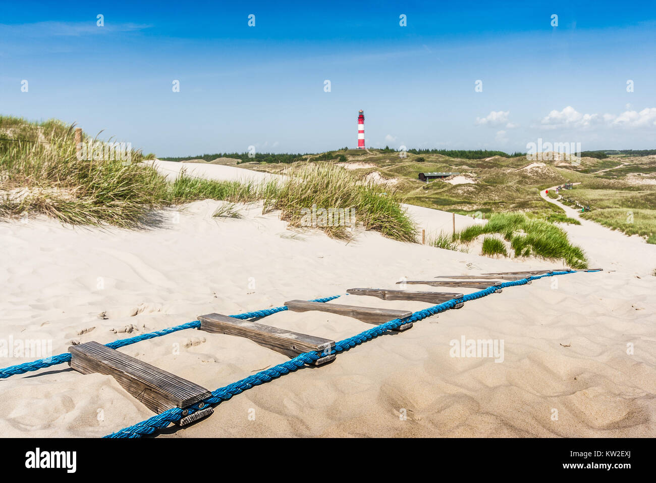 Beautiful dune landscape with traditional lighthouse at North Sea, Schleswig-Holstein, Germany Stock Photo