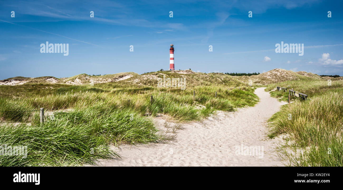 Beautiful dune landscape with traditional lighthouse at North Sea, Schleswig-Holstein, Germany Stock Photo