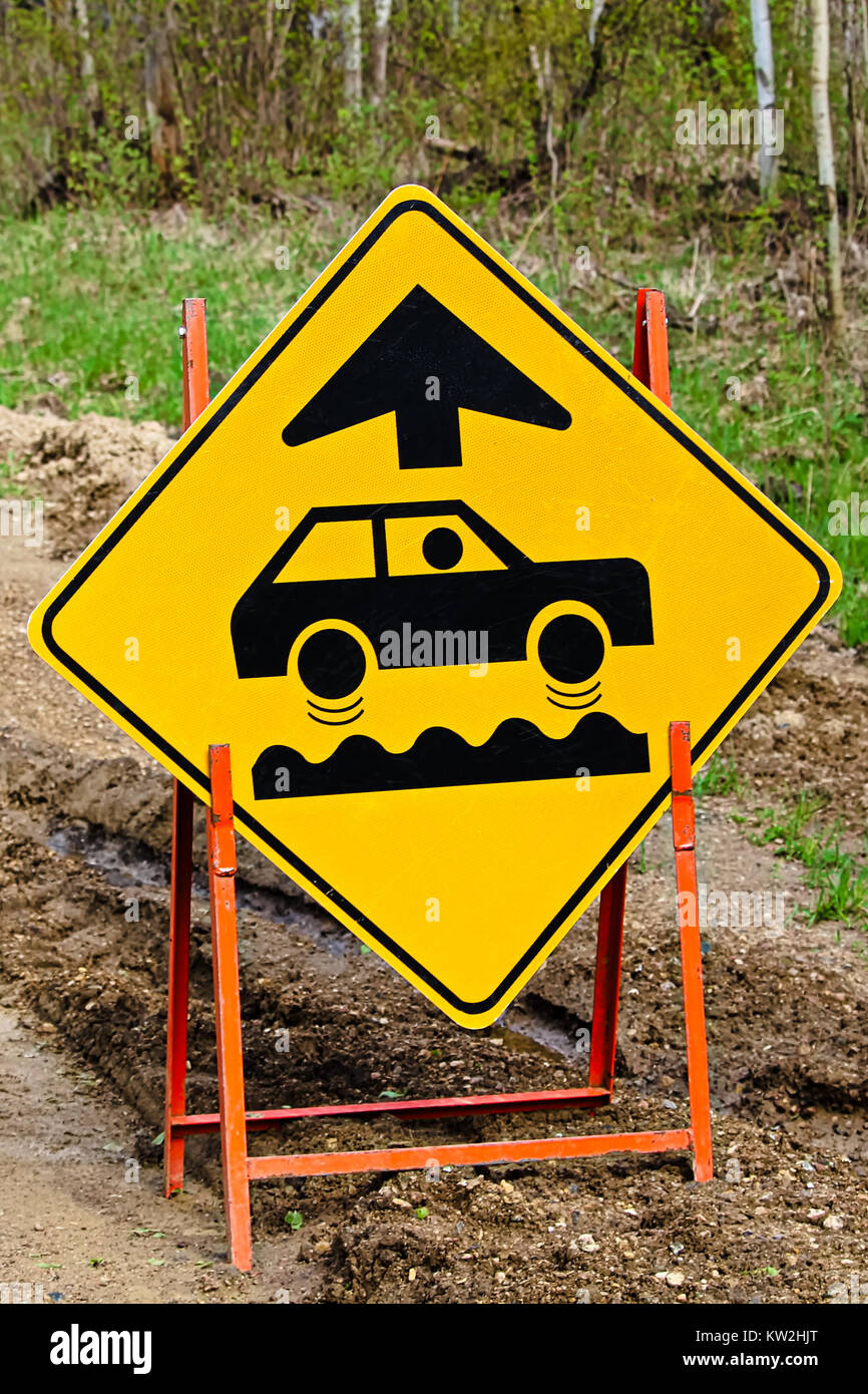 Closeup of a bumpy road ahead sign. Stock Photo