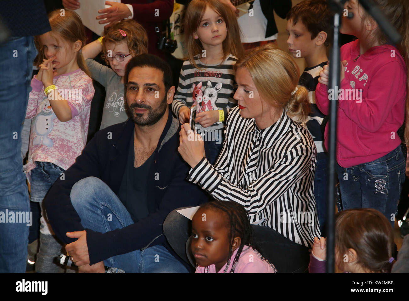 Charity gift wrapping with stars for 'Ein Herz fuer Kinder' at the shopping mall Europa Passage in Hamburg  Featuring: Kim Sarah Brandts, Volkan Baydar Where: Hamburg, Germany When: 27 Nov 2017 Credit: Becher/WENN.com Stock Photo