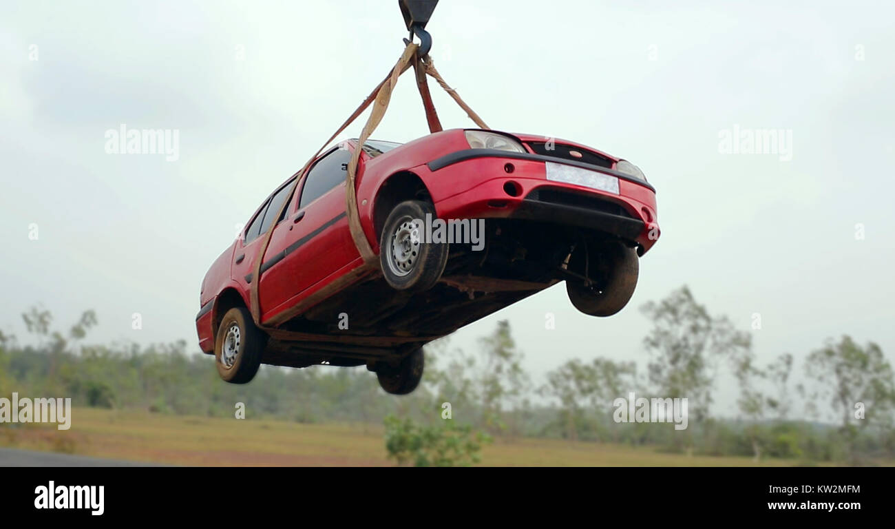 towing damaged car with a tow truck from the road Stock Photo Alamy