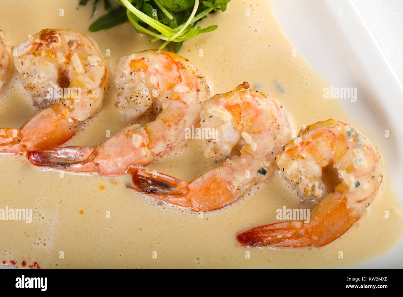 Prawn in cream sauce with rucola Stock Photo - Alamy