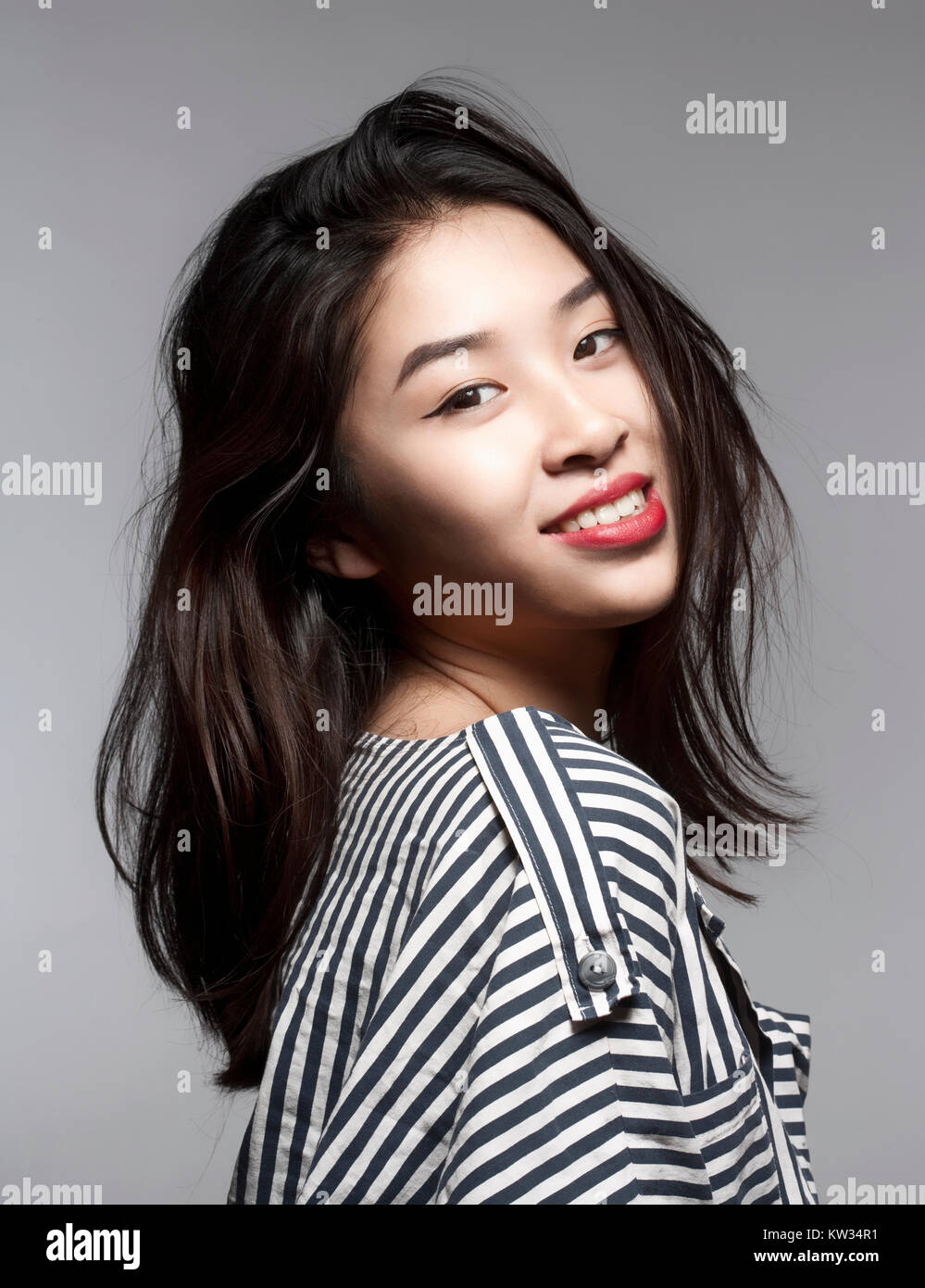 Studio Portrait of a Teenage Girl Smiling Stock Photo - Alamy