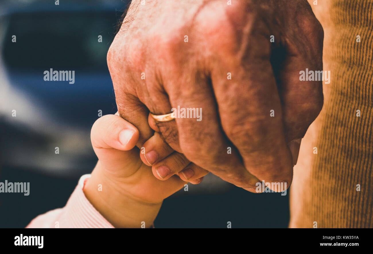 Hands of grandfather and grandson Stock Photo