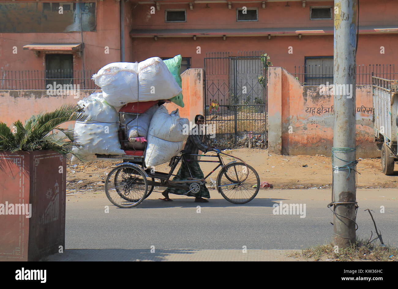 Indian man carries heavy load in Jaipur India. Stock Photo