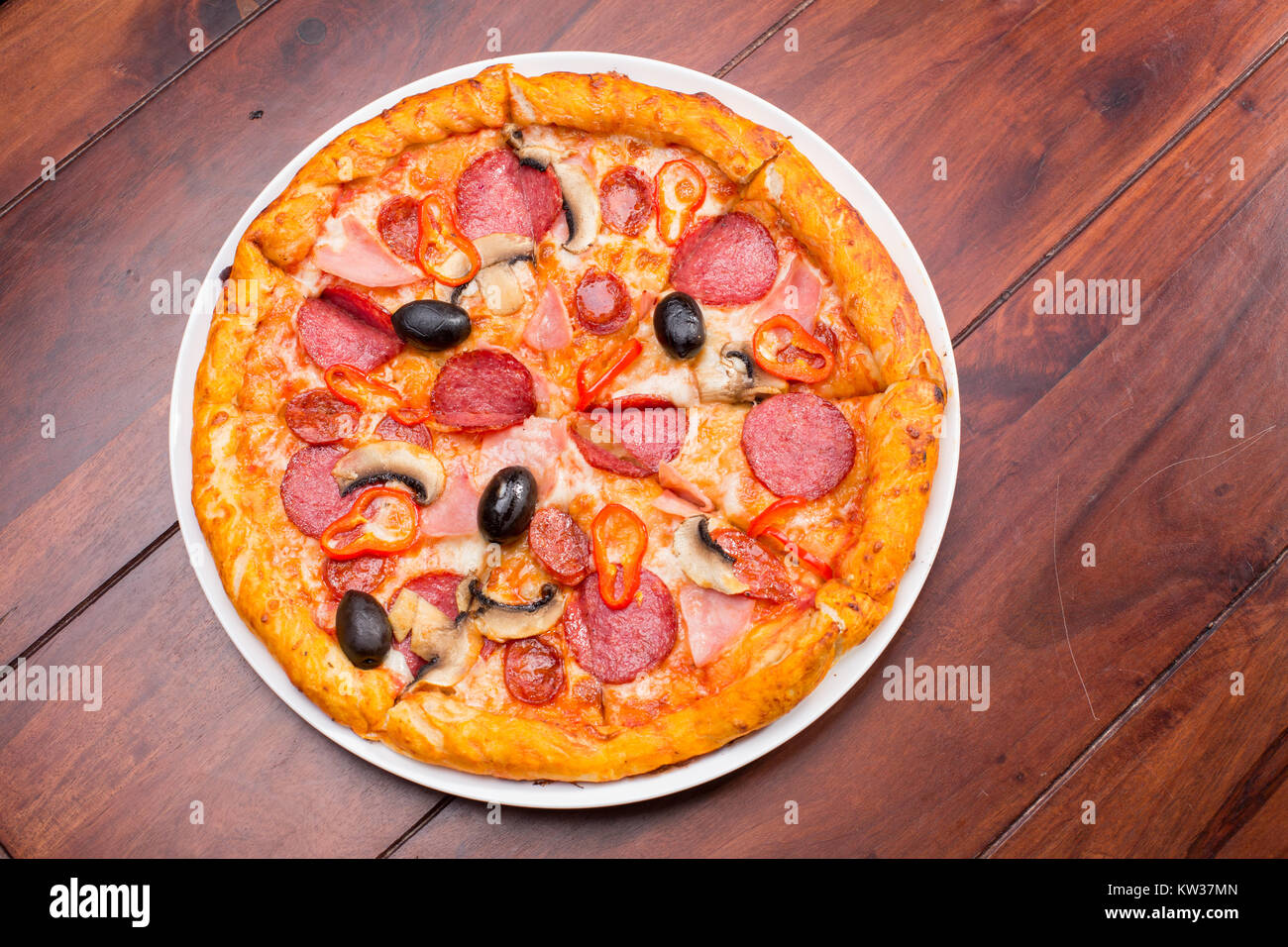Italian pizza with salami, cheese, mushrooms and olives Stock Photo Alamy