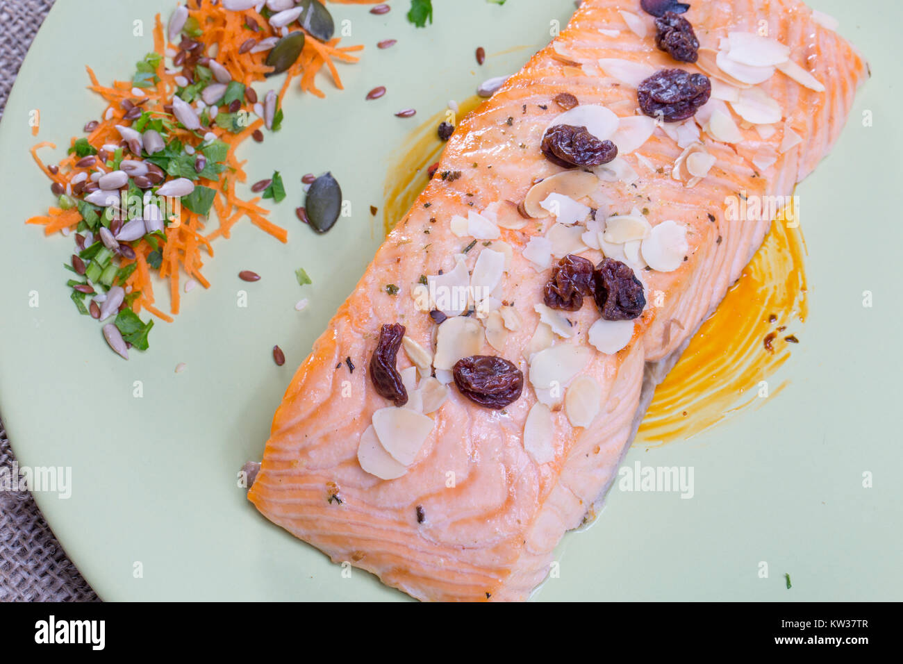 close up salmon steak on a green plate Stock Photo